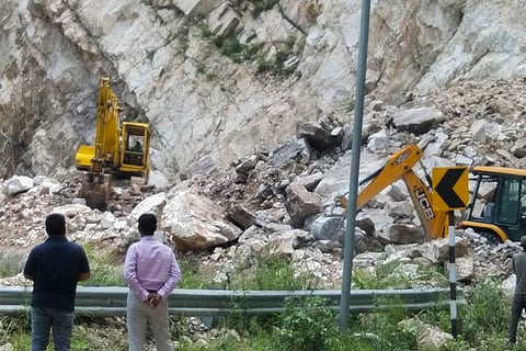 Debris being cleared from a blocked road in Rudraprayag